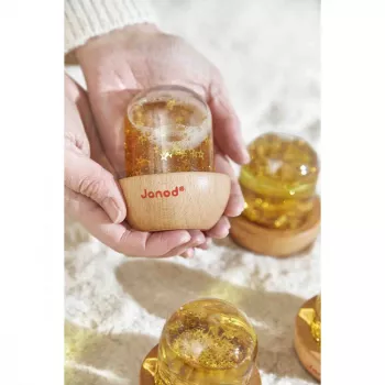 Minge glob de zăpadă senzorială Janod galbenă 12m+